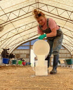 Enthusiastic young dairy farmer encourages others